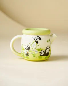 Detailed shot of the cute panda ceramic teapot showing fine green gradient glaze finish.