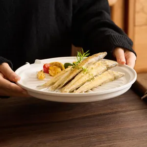 White ceramic draining plate with spout for food presentation, elegant tableware.
