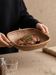 Close-up detail view of the retro ceramic dual-ear plate holding a delicious grilled steak.