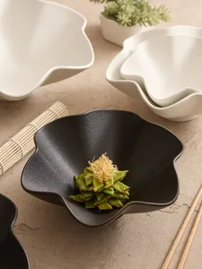 Detailed shot of ceramic plum blossom bowl featuring delicate line texture, elegant table setting.