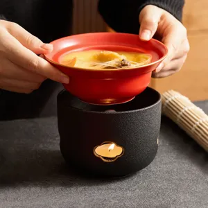 Keramik Auflaufset mit Kerzenwärmer, rote Schüssel und schwarzer Ofen für warme Speisen.