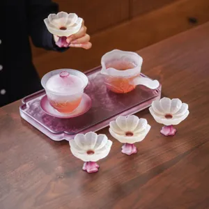 Exquisite lotus glass tea set with gaiwan and fair cup, elegant gradient pink design for home.