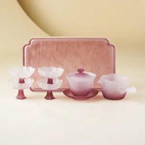 Exquisite frosted glass lotus tea set with gaiwan, fairness cup and elegant tea tray.
