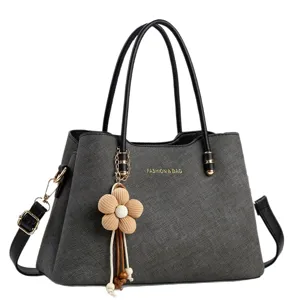 Large capacity women shoulder crossbody handbag, stylish commute tote bag with flower charm.