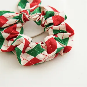 Christmas plaid hair scrunchie detail view, showing red green pattern with bunny ears.