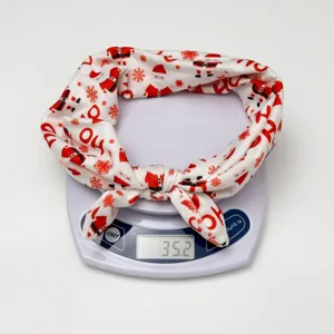 Christmas knotted headband with Santa Claus print elastic bow hair band for women holiday.