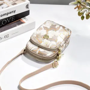 Floral embroidered double zipper crossbody bag, small vertical phone bag with shoulder strap.
