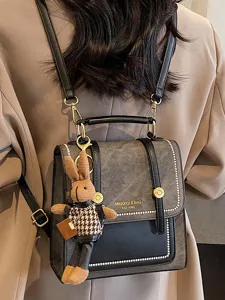 Vintage college style retro backpack with cute rabbit pendant for women daily commuting.