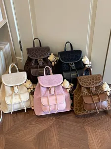 Sac à dos vintage à imprimé léopard grande capacité, cartable élégant avec joli pendentif d'ours.