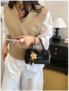 Chic niche design women barrel shoulder bag spring fashion casual crossbody handbag detail.
