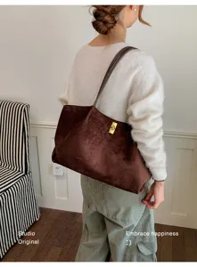 Brown suede tote bag detailed view, large capacity shoulder bag for daily commute & chic style.