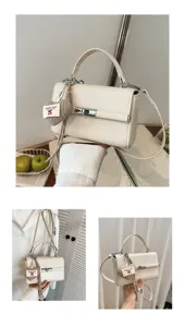 Cream white top handle crossbody bag for women, chic small square bag with heart pendant.