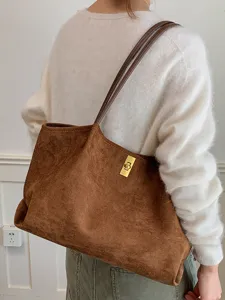 Chic brown suede tote bag for women, large capacity shoulder bag with elegant gold lock.