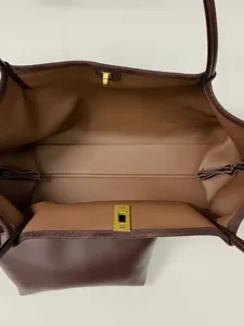 Spacious brown leather tote bag interior view, ideal for daily commute and casual style.
