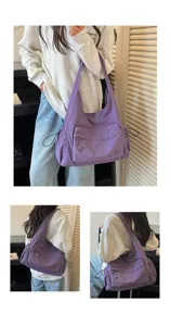 Vista ravvicinata della borsa a tracolla viola casual con coulisse laterali e tasca frontale.