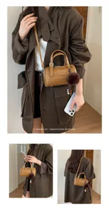 Sac bandoulière cylindrique en cuir marron pour femme sac à main rétro minimaliste avec pompon