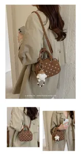 Korean style polka dot bowling bag detail showcasing cute plush charm and retro shoulder strap.