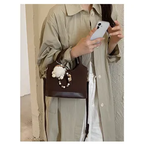 Chic brown commuter shoulder bag with cute plush charm, perfect for daily casual and work outfits.