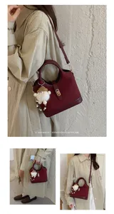 Stylish retro commuter shoulder bag for women, Korean style chic handbag with cute plush charm.