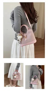 Pink minimalist women handbag shoulder bag, stylish commuting retro design with chic charm.