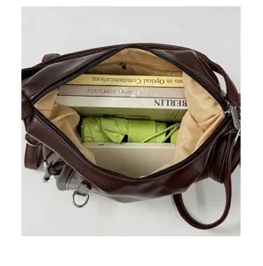 Brown large capacity leather shoulder bag tote daily commuter bag spacious interior for books.
