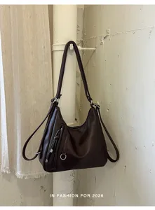 Dark brown large capacity PU leather shoulder bag backpack casual commuting daily tote.