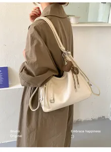 Korean style large capacity shoulder bag fashionable casual tote bag for women daily commute.