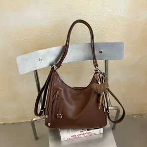 Brown large capacity leather shoulder bag, casual commuting tote handbag with chic charm.
