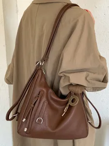 Stylish brown leather multi-way shoulder bag and backpack for daily commute and casual use.