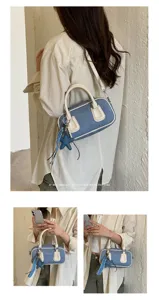 Retro denim boston shoulder bag for women, chic patchwork design with star charm and pearl strap.