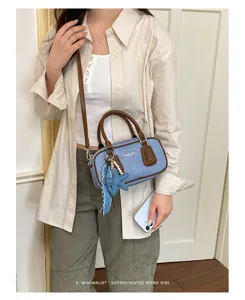 Denim Boston shoulder bag for women, retro casual handbag with handle and star pendant.
