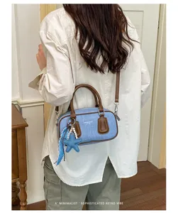 Retro denim boston shoulder bag for women, stylish casual crossbody purse with star charm.