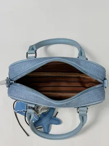 Light blue Boston handbag, retro shoulder crossbody pillow bag with star charm and striped lining.