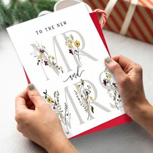 Wedding greeting card with floral MR and MRS typography design for newly married couples