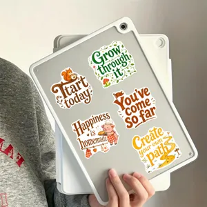 Carini adesivi con citazioni motivazionali e animali sul tablet, cancelleria estetica.