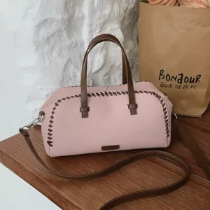 Sac à main Boston rose vintage avec poignées marron, sac bandoulière élégant et décontracté.