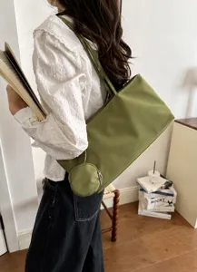 Green nylon tote bag with round pouch, casual commute shoulder bag for women daily use.