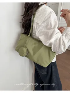 Minimalist casual nylon shoulder tote bag in olive green, perfect for daily commuting use.