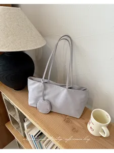 Grey nylon shoulder tote bag detail shot, versatile vintage style for women daily commute.