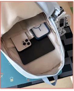 Detailed view of the cute Japanese style student backpack interior compartments holding items.