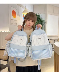 Sweet style cute polka dot backpack with lace trim, large capacity school bag for students.