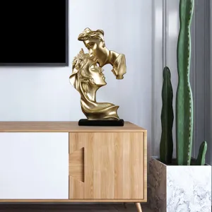 Golden kissing couple resin sculpture, modern home decor ornament for living room or office desk.