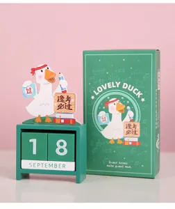 Detailed shot of wooden perpetual calendar with cute duck decor and math formulas box.