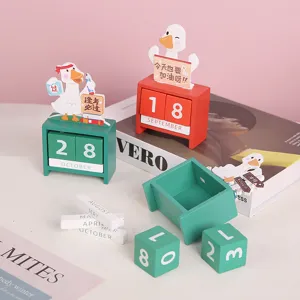 Cute wooden perpetual desk calendar with cartoon duck design, perfect study room desktop decoration.