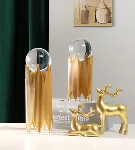 Luxury crystal ball ornament with gold metal stand and deer figurines for home desk decor.