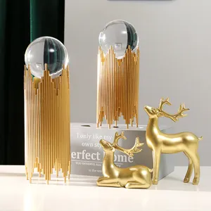Luxurious crystal ball and golden deer ornament set for home desktop living room decor.