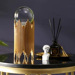 Luxury crystal ball decor with gold metal stand, perfect modern tabletop ornament for living room home office.