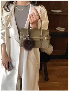 Elegant green woven handbag for women, vintage shoulder crossbody bag with fluffy charm.