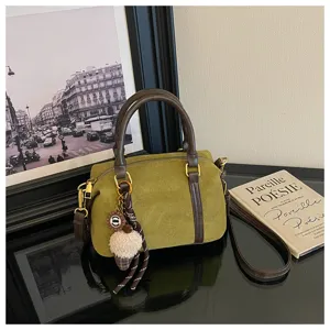 Vintage green Boston handbag for women, casual suede-look shoulder bag with top handles.