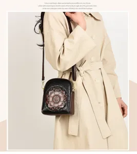 Retro embossed crossbody bag for women, vintage floral shoulder phone bag with slim strap.